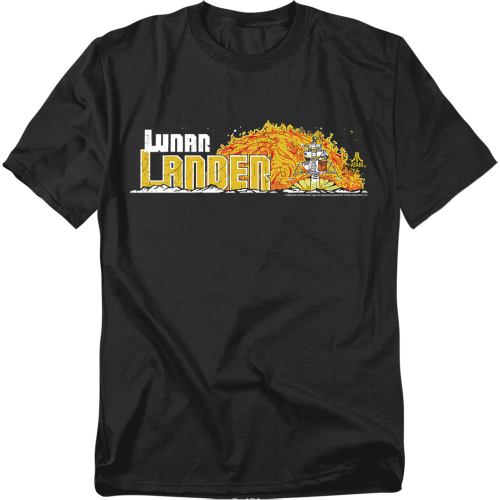 Black t-shirt featuring Atari’s Lunar Lander logo in bold white and yellow text, with vintage arcade artwork of a spacecraft descending against a fiery orange and yellow explosion-style backdrop.