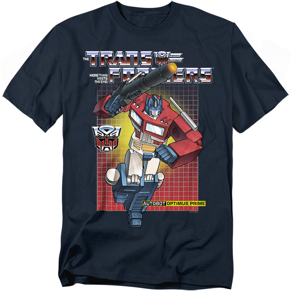 Navy t-shirt featuring Optimus Prime in front of a red-to-yellow grid background with the Transformers logo, Autobot insignia, and the phrase “More Than Meets the Eye.”