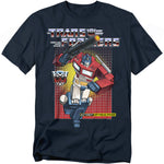 Navy t-shirt featuring Optimus Prime in front of a red-to-yellow grid background with the Transformers logo, Autobot insignia, and the phrase “More Than Meets the Eye.”