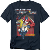 Navy t-shirt featuring Optimus Prime in front of a red-to-yellow grid background with the Transformers logo, Autobot insignia, and the phrase “More Than Meets the Eye.”