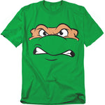 Green t-shirt featuring Michelangelo’s face from Teenage Mutant Ninja Turtles with an angry, determined expression in cartoon style.