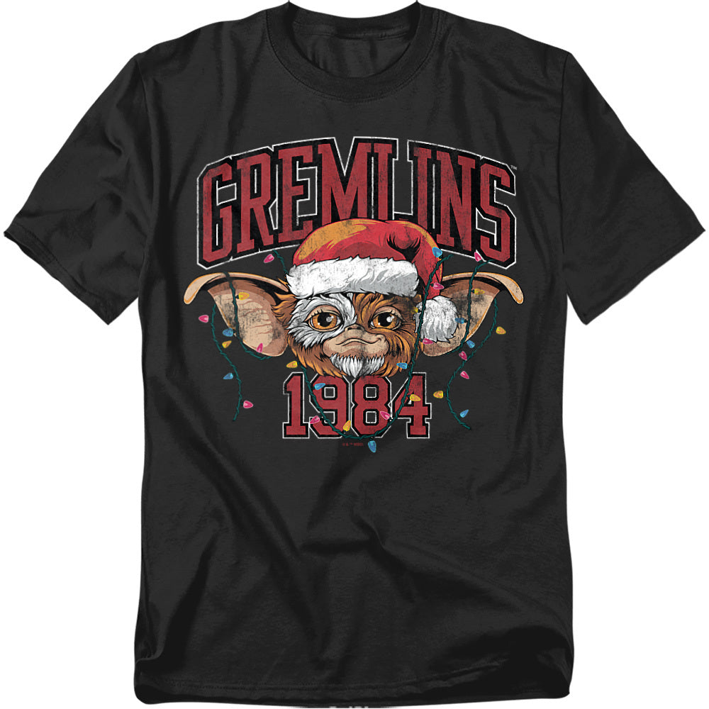 Black t-shirt featuring Gizmo from Gremlins wearing a Santa hat with Christmas lights and the text “Gremlins 1984.”