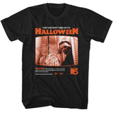 Black T-shirt featuring a vintage TV broadcast design of John Carpenter’s Halloween with Michael Myers and orange retro graphics.