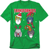 Green T-shirt featuring festive Transformers characters dressed as Santa, elves, and reindeer with snowflakes in the background.