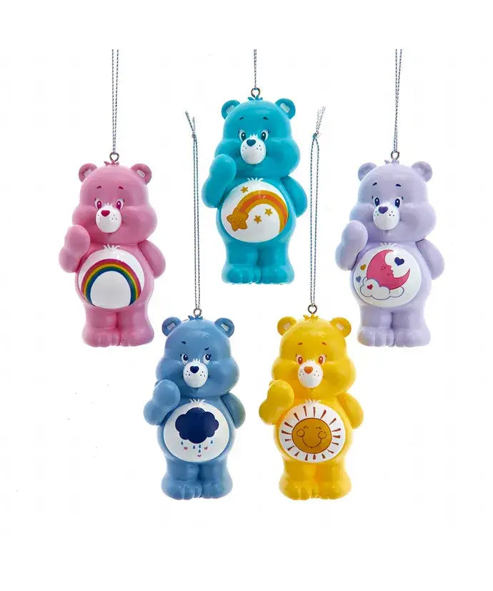Set of five colorful Care Bears ornaments, each with different belly badges, hanging from silver strings.