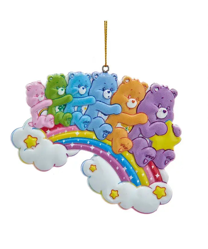 Colorful Care Bears ornament featuring multiple bears hugging on a rainbow with clouds and stars.