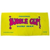 Bright yellow Bubble Gum Surf Wax beach towel featuring oversized pink and blue logo artwork with Est 84 branding