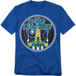Bright blue t-shirt featuring retro Atari Star Raiders artwork, with a bold yellow and blue spaceship flying through a circular galactic design against a starry background.