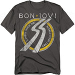 Charcoal t-shirt with a circular yellow-and-white design featuring a slippery road sign graphic and the words “Bon Jovi Slippery When Wet World Tour 1987.”