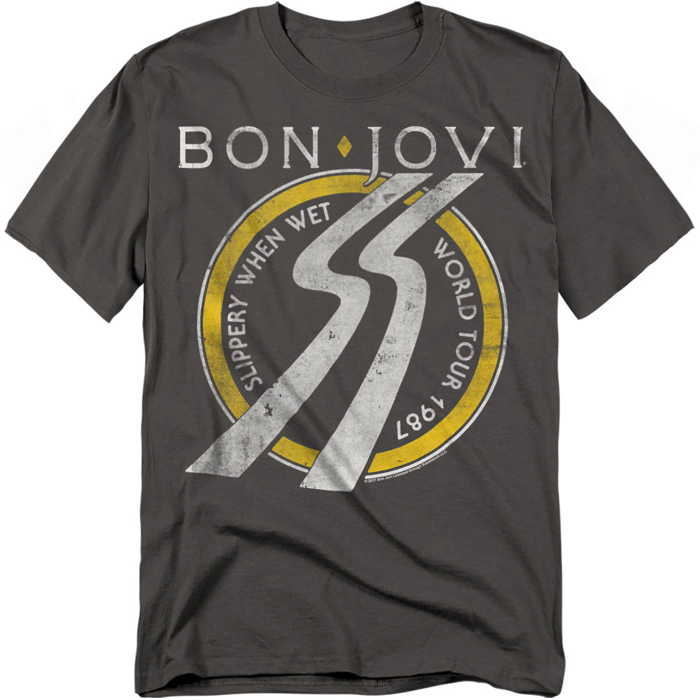 Charcoal t-shirt with a circular yellow-and-white design featuring a slippery road sign graphic and the words “Bon Jovi Slippery When Wet World Tour 1987.”