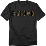 Black t-shirt with bold “BATMAN” block letters in gold and red, inspired by the 1989 film.