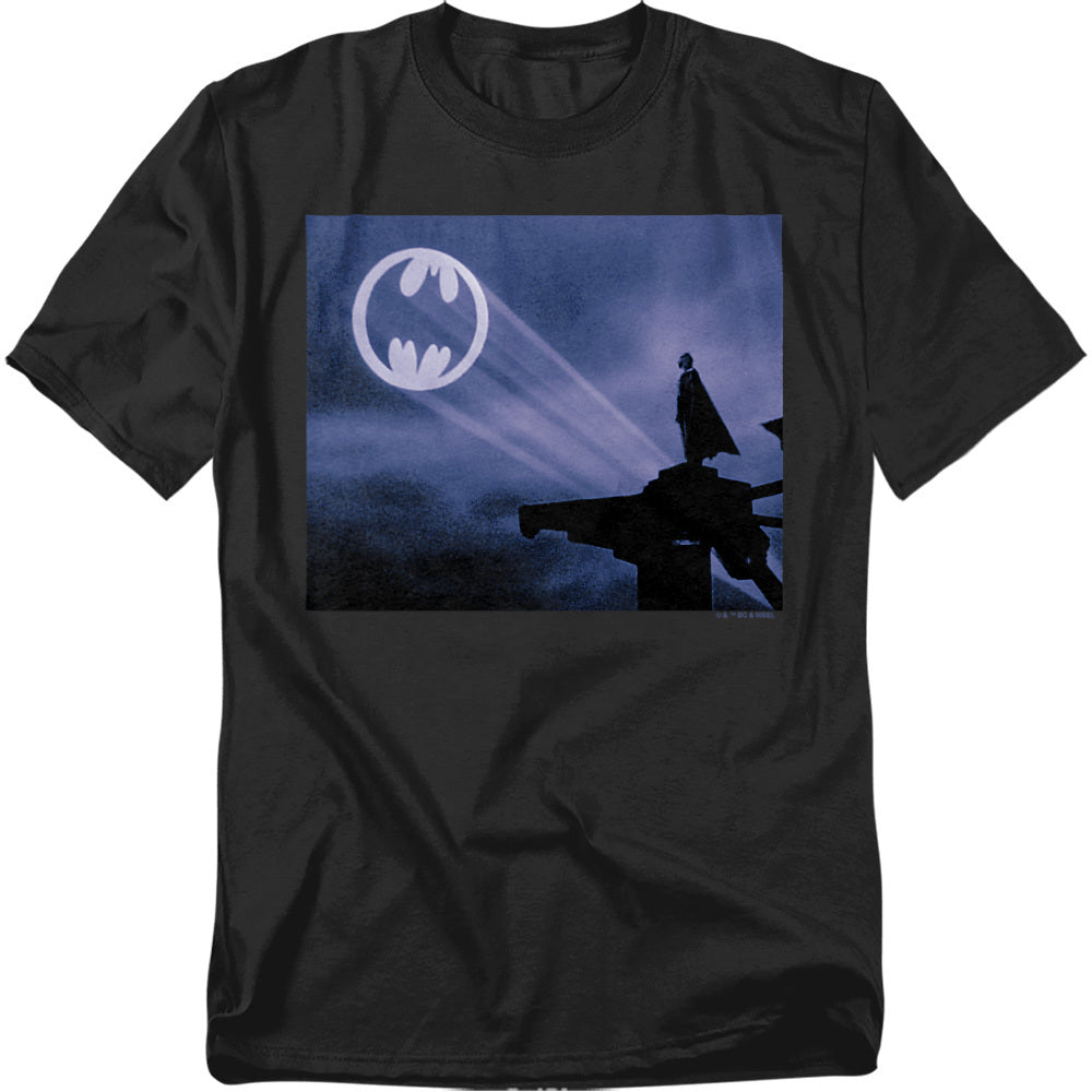 Black t-shirt featuring Batman standing on a rooftop with the Bat-Signal shining in the sky, inspired by the 1989 film.