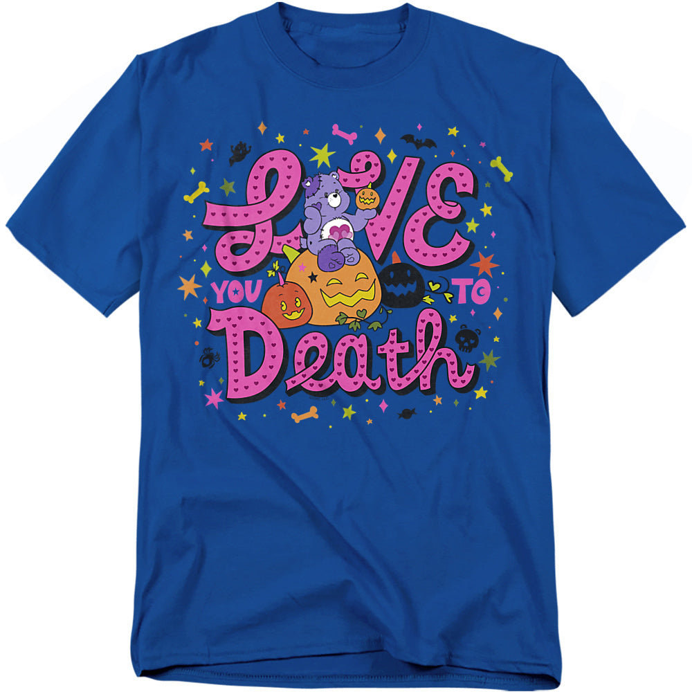 Blue t-shirt featuring Harmony Bear sitting on a pumpkin, holding a small jack-o’-lantern, with bold pink lettering that reads “Love You to Death,” surrounded by colorful stars, bats, bones, and Halloween icons.