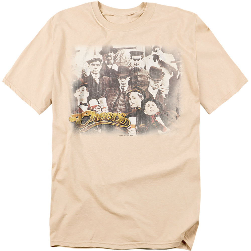 Beige t-shirt with vintage sepia cast photo from Cheers and classic logo in gold script.