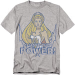 A gray t-shirt featuring She-Ra from She-Ra: Princess of Power. She is illustrated with long blonde hair, a white costume, and a golden tiara. Below her, bold distressed blue text reads “I HAVE THE POWER!” with lightning bolt graphics surrounding the design.