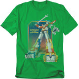 A green t-shirt featuring Voltron in his full combined form, holding his blazing sword high. The artwork shows the giant robot with his lion limbs in bold colors against a cosmic background. Beside him, the text reads “Defender of the Universe” in yellow.