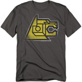 A charcoal gray t-shirt featuring the yellow lion head from Voltron in a bold, angular graphic design. The artwork highlights the mechanical details of the lion’s face, symbolizing its role as one of Voltron’s mighty limbs.