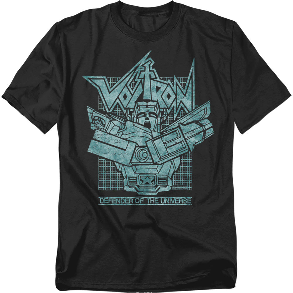 A black t-shirt featuring a teal line-art style graphic of Voltron with arms crossed in front of a retro grid background. The word "Voltron" appears in a bold stylized font above, and "Defender of the Universe" is written below the image.