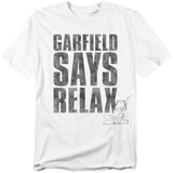 White t-shirt with large black text that reads “Garfield Says Relax” and a small graphic of Garfield reclining in a chair at the bottom.