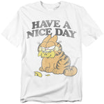 White Garfield t-shirt with the phrase “Have a Nice Day” above Garfield sitting with a lemon rind in his mouth and a sour, unimpressed expression.