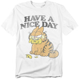 White Garfield t-shirt with the phrase “Have a Nice Day” above Garfield sitting with a lemon rind in his mouth and a sour, unimpressed expression.