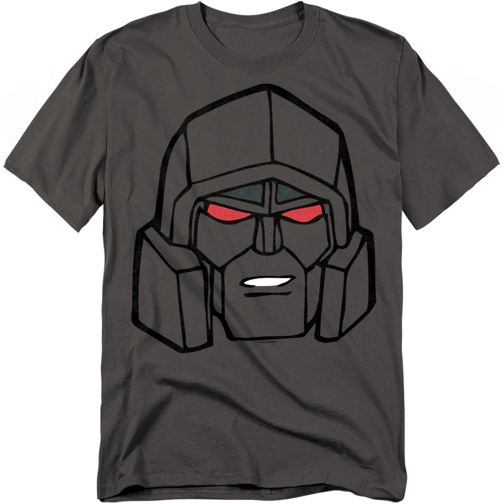 Charcoal gray t-shirt featuring a large cartoon-style close-up of Megatron’s face with red eyes and black outlines in G1 Transformers design.