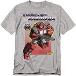 Heather grey T-shirt with G1-style Transformers Ironhide graphic and retro red grid background.