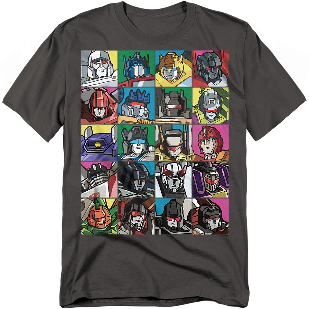 Charcoal t-shirt featuring a colorful grid of classic Transformers character faces, including Autobots and Decepticons from the Generation 1 cartoon.