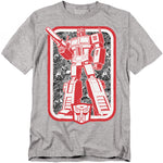 Gray t-shirt featuring Optimus Prime with a red Autobot logo below, styled in retro Transformers cartoon artwork.