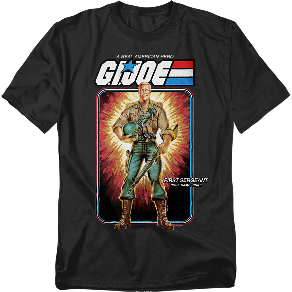 Black t-shirt featuring G.I. Joe’s Duke in green uniform with helmet and rifle, displayed in vintage cardback art style with explosive background.