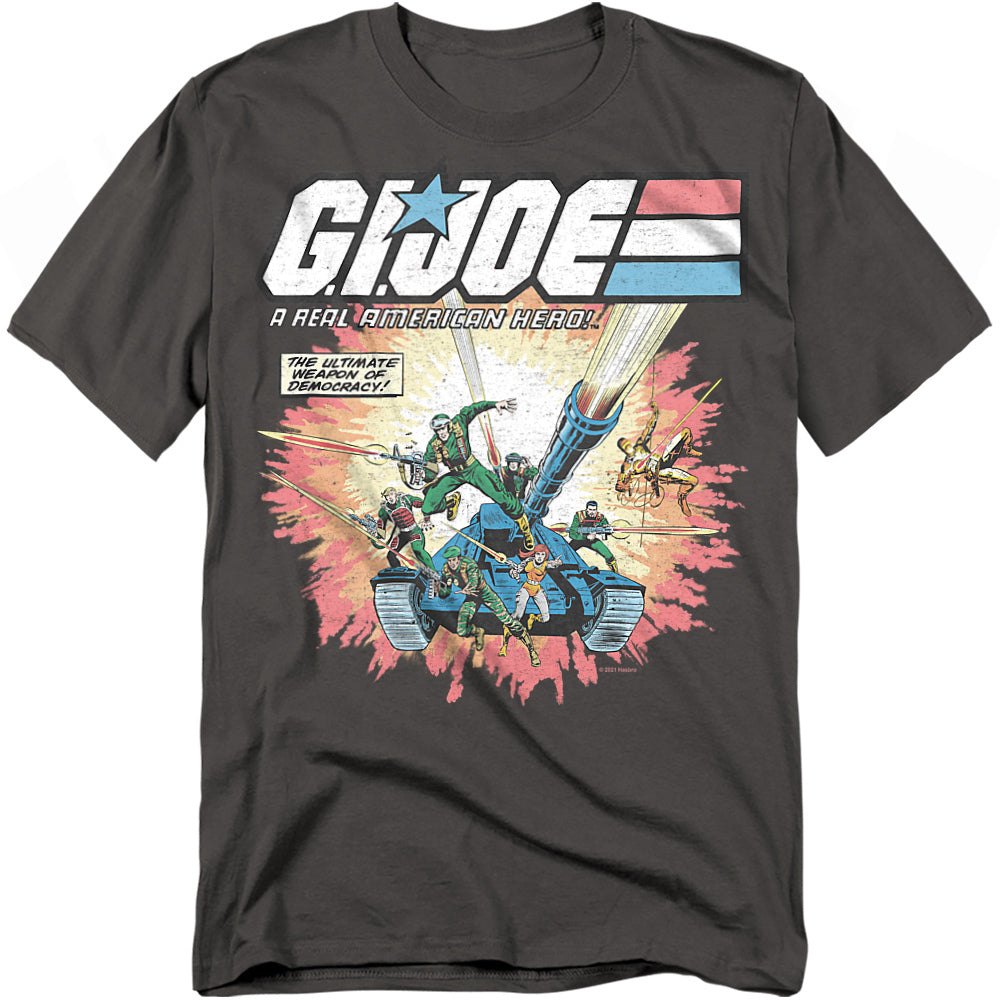 Charcoal gray t-shirt featuring classic G.I. Joe comic book art with heroes charging from a tank, firing weapons, and text reading “The Ultimate Weapon of Democracy.”