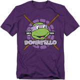 Purple t-shirt featuring Donatello from Teenage Mutant Ninja Turtles with his bo staff and retro 'Since 1984' design.