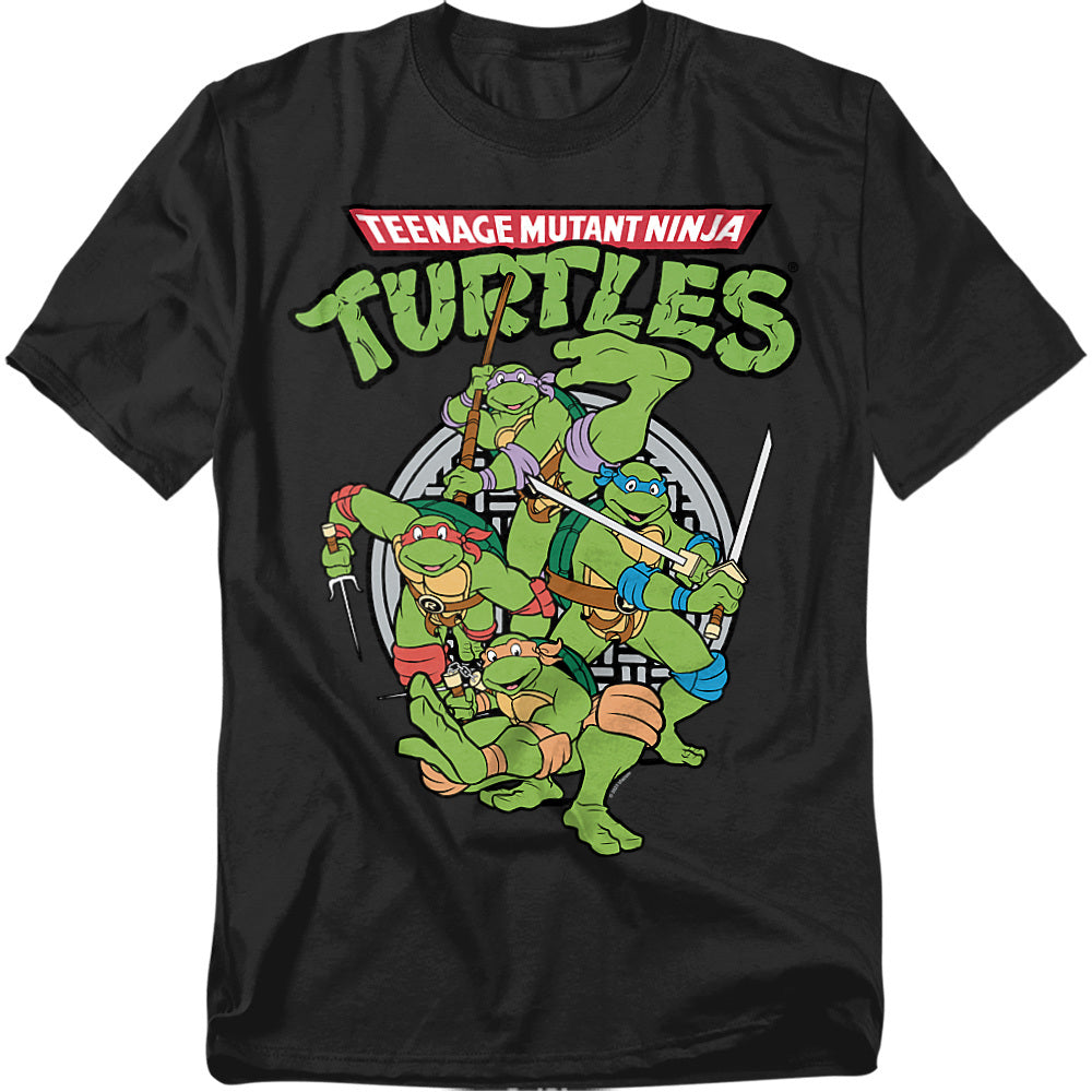 Black Teenage Mutant Ninja Turtles t-shirt featuring Leonardo, Donatello, Michelangelo, and Raphael in action poses with weapons, retro cartoon style.