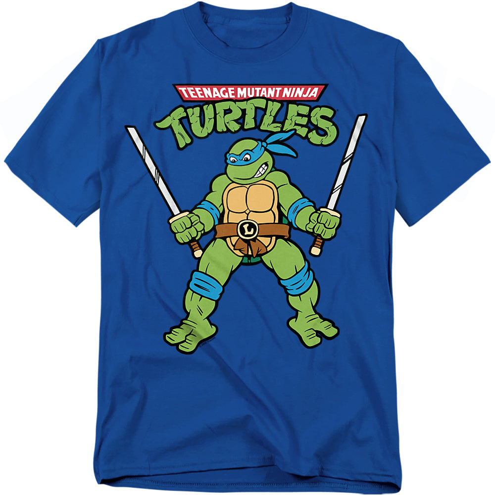 Blue t-shirt featuring Leonardo from Teenage Mutant Ninja Turtles holding twin katanas with retro cartoon artwork.