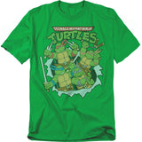 Green Teenage Mutant Ninja Turtles t-shirt featuring Leonardo, Donatello, Michelangelo, and Raphael breaking through with their weapons, classic cartoon style.