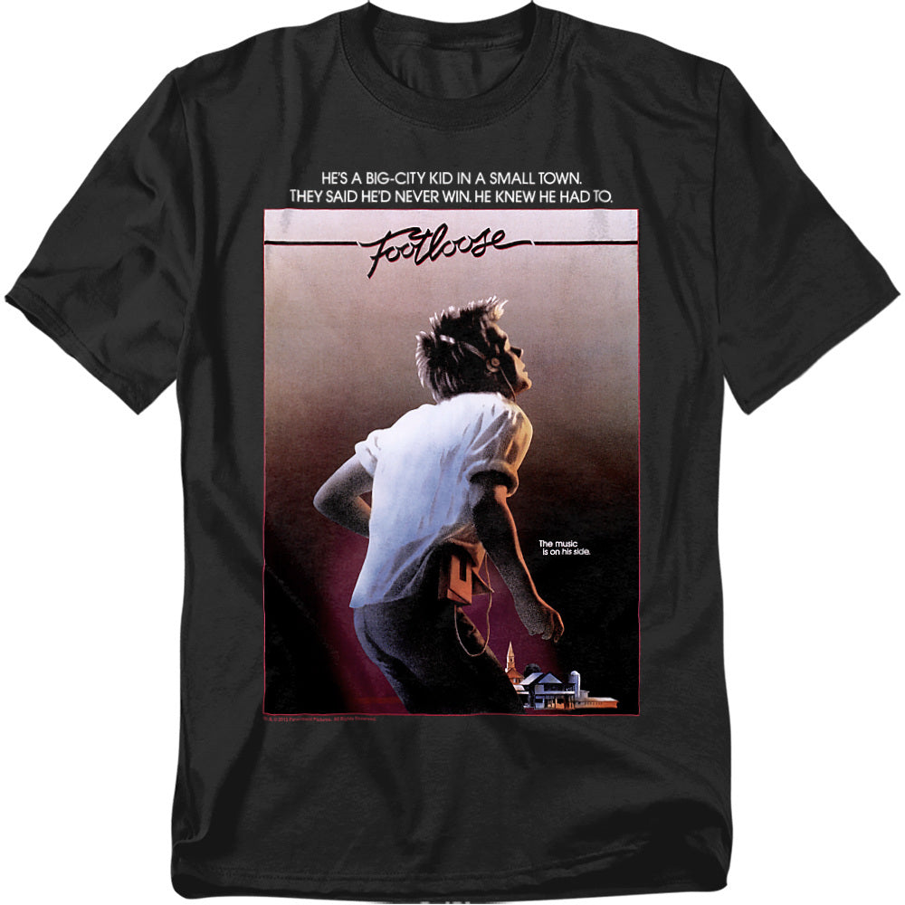 Black t-shirt with 1984 Footloose movie poster featuring Kevin Bacon dancing and the tagline “The music is on his side.”