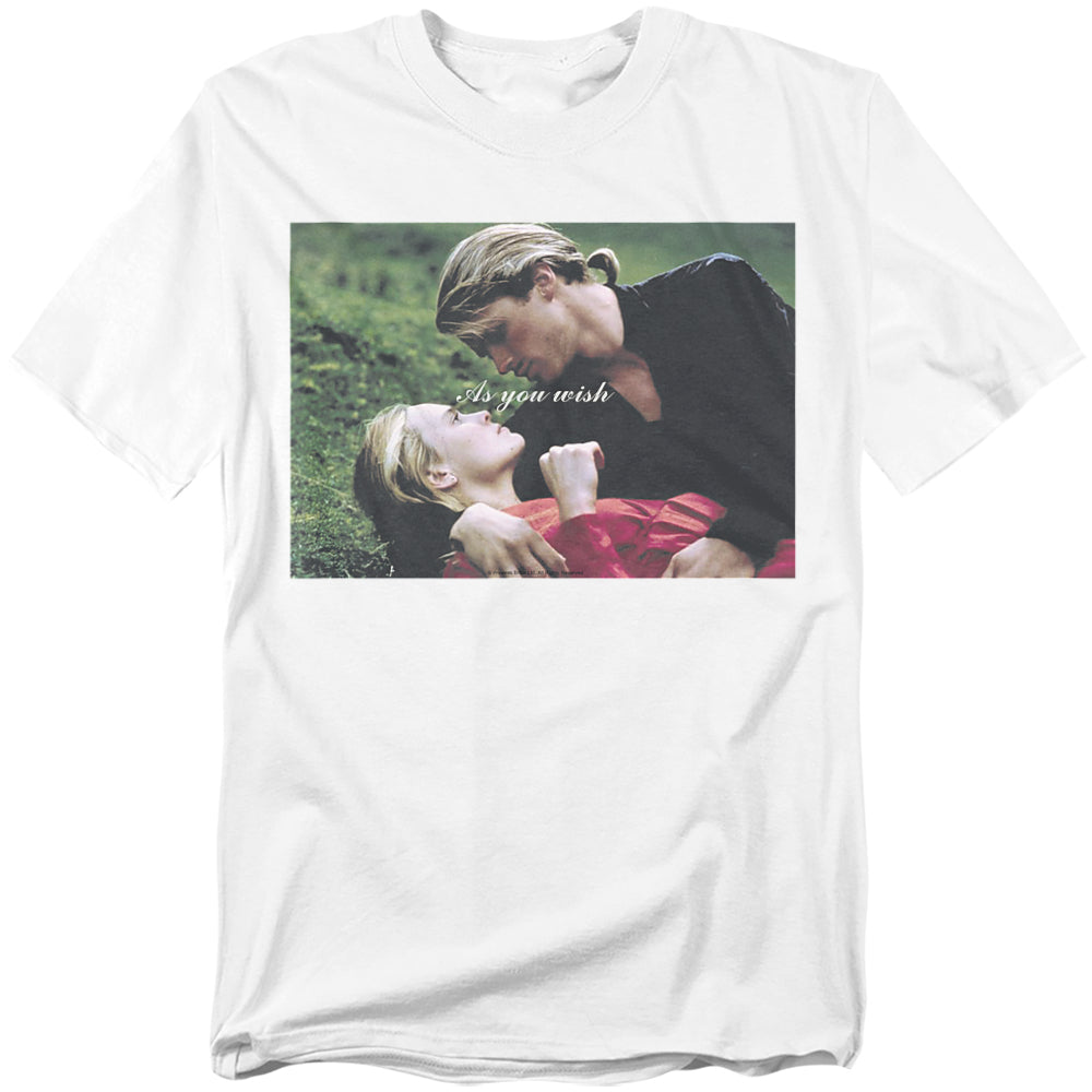 White t-shirt with a full-color image of Westley and Buttercup lying in the grass from The Princess Bride, with the words “As you wish” across the center.