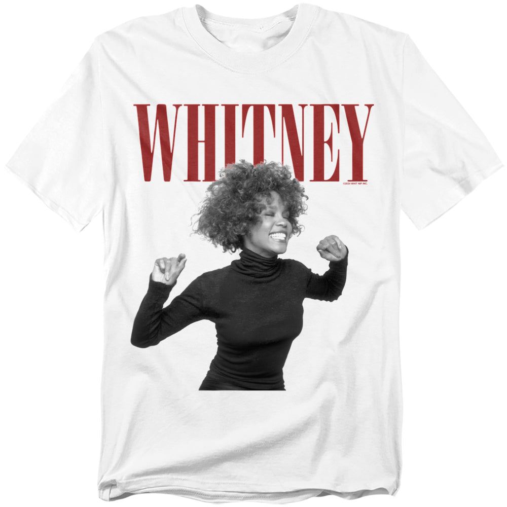 White t-shirt with bold red “WHITNEY” text and a black-and-white photo of Whitney Houston smiling in a joyful pose with raised arms.