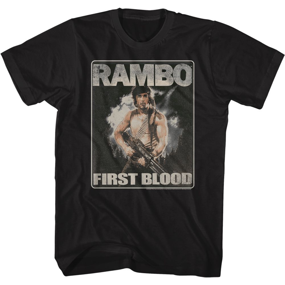 Black vintage-style t-shirt featuring the classic Rambo: First Blood movie poster art, with John Rambo holding a machine gun and standing against a smoky, action-filled backdrop.