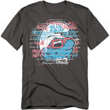 Charcoal t-shirt with graffiti-style Smurf wearing red sunglasses on a brick wall background with colorful spray-paint text.