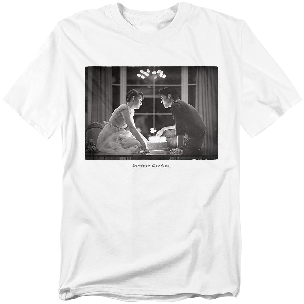 White t-shirt with a black-and-white image of Samantha and Jake from Sixteen Candles leaning over a birthday cake, with the movie title written below.
