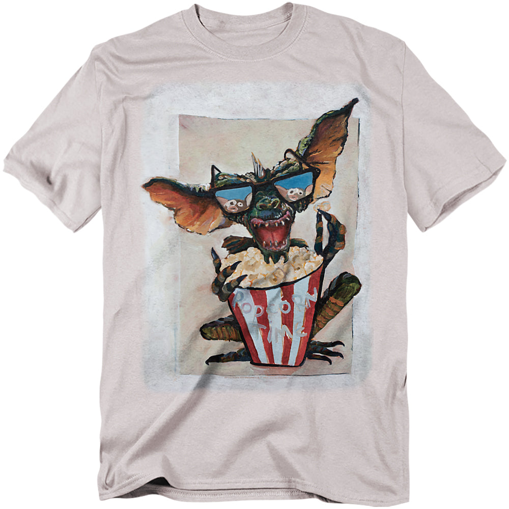 T-shirt with a graphic of a creature eating popcorn on a white background