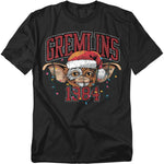 Black t-shirt featuring Gizmo from Gremlins wearing a Santa hat with Christmas lights and the text “Gremlins 1984.”