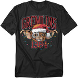 Black t-shirt featuring Gizmo from Gremlins wearing a Santa hat with Christmas lights and the text “Gremlins 1984.”