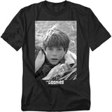 Black t-shirt with a graphic of a young boy and 'The Goonies' logo on a white background