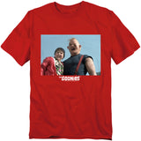 Red t-shirt with a graphic of two people and 'The Goonies' text on a white background