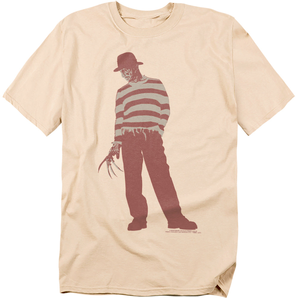 Beige t-shirt with a graphic of a character in a striped shirt and hat on