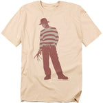 Beige t-shirt with a graphic of a character in a striped shirt and hat on