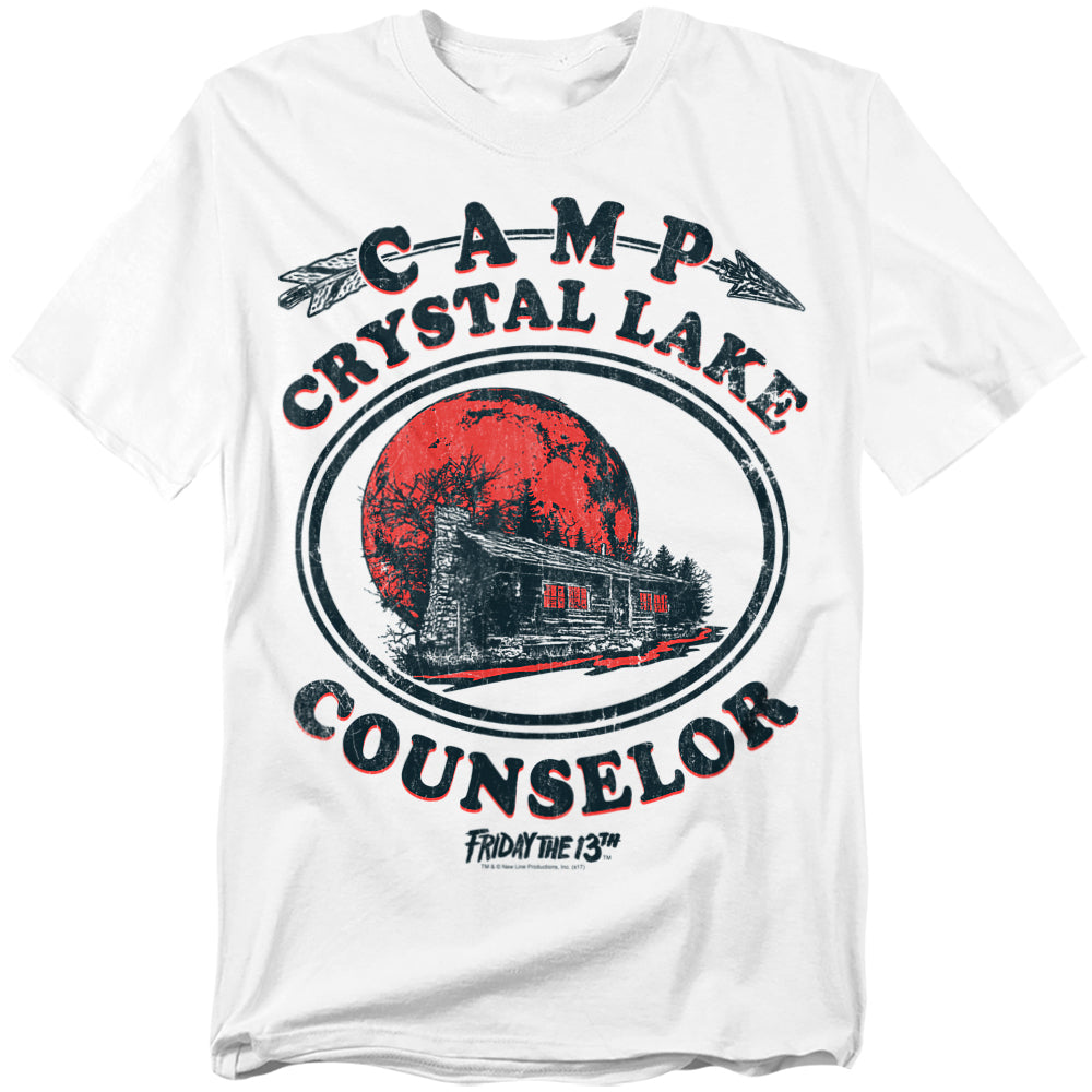 White t-shirt with 'Camp Crystal Lake Counselor' design featuring a cabin and moon.