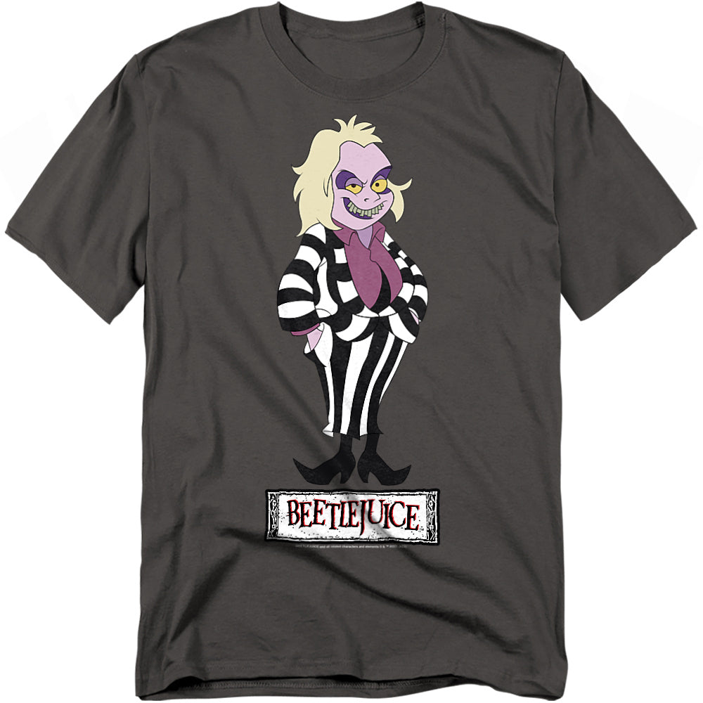A charcoal gray t-shirt featuring a cartoon version of Beetlejuice from the animated series. He is drawn with pale purple skin, yellow eyes, and messy blonde hair. Beetlejuice wears his iconic black and white striped suit with a purple shirt and red tie, standing confidently with his hands in his pockets. Below him is the word "Beetlejuice" in a distressed black and red logo.